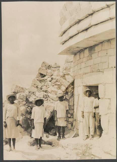 El Caracol, workers on east side of tower in front of fallen section
