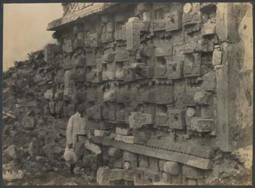 Kabah, Yucatan, structure 2C6, man next to sculptured lower zone