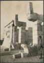 Boy standing in front of Temple of Warriors