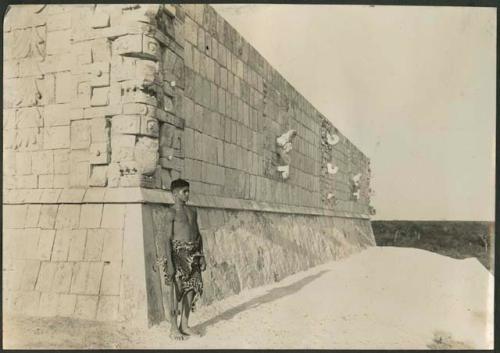 Boy standing next to sanctuary at Temple of Warrirors