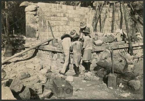 Temple of Three Lintels, northwest exterior corner under repair