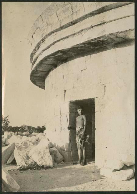 Caracol, boy standing in western doorway