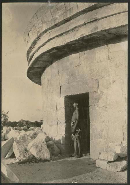 Caracol, boy standing in western doorway