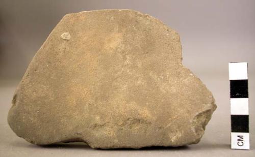 Fragment of polishing stone; worked on two faces