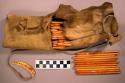 Caribou skin bag and set of small maple gambling sticks