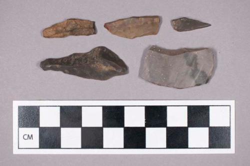 Chipped stone, uniface blade and drill fragments