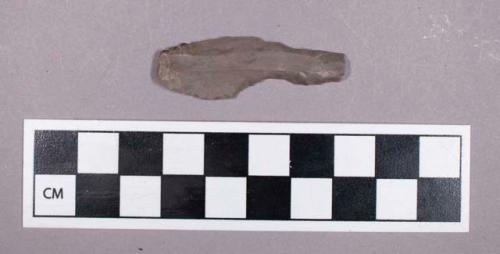 Chipped stone, uniface blade fragment with retouched edges