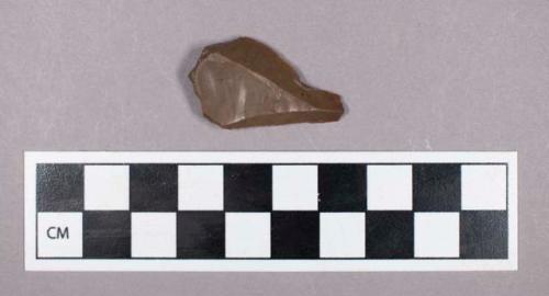 Chipped stone, utilized flake fragment with retouched edge