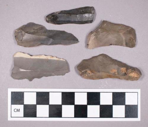 Chipped stone, uniface blade fragments