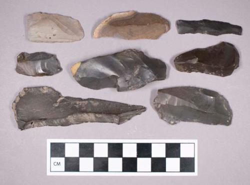 Chipped stone, uniface blade fragments, some with retouched edges