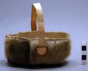 Small fur basket with hide handle