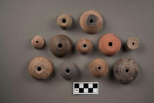 Terra cotta spindle whorls