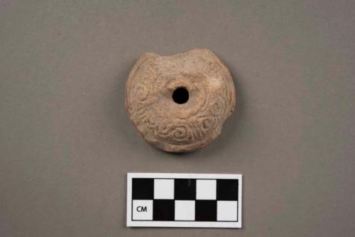 3 pottery spindle whorls with molded and stamped decoration