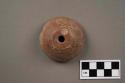 Incised pottery spindle whorl
