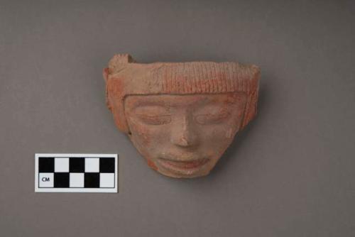 Red face from pottery brasero