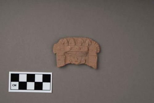 Miniature pottery throne fragment