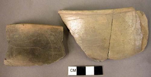 11 potsherds-burnished grey ware; fine line incision