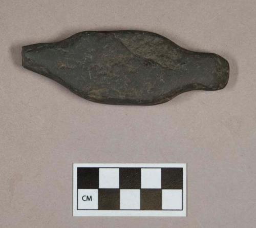 Ground stone, worked stone object, narrowed at both ends