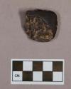 Ground stone, adze fragment, hematite