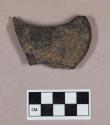 Worked coal fragment, flat, one rounded edge