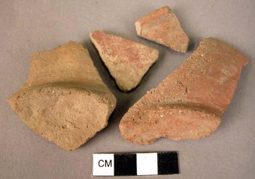 2 rim potsherds, 2  fragments of bases - plain ware, unburnished, unslipped (Wac