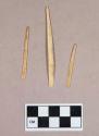 Organic, worked animal bone fragments, flat, rounded at one end