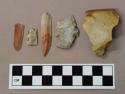 Chipped stone, including prismatic blades, flakes, debitage, biface, projectile point, flake scraper, and one earthenware sherd