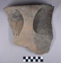 Ceramic, earthenware rim sherds, shell-tempered, strap handle, punctate, incised, and cord-impressed