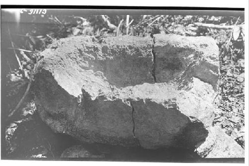 Ancient heavily grooved metate from mound on road to Paul's Temple.