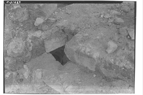 Caracol, olla under block of masonry top of niche - upper stairway.