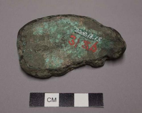 Metal fragments, rounded edges, green patina