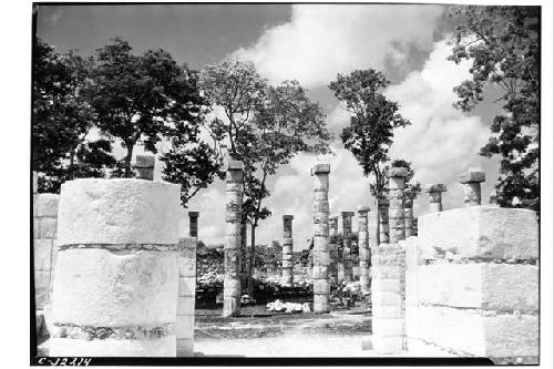 Looking south through doorway, columns restored at Patio Mercado.