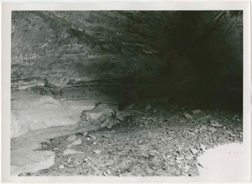 Deeply pecked petroglyphs inside cavern