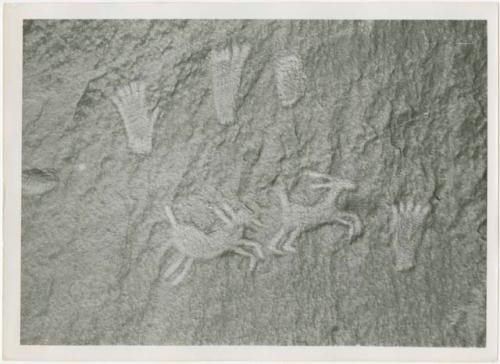 Petroglyph with bighorn sheep and foot prints