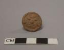 Small pottery stamp, human head