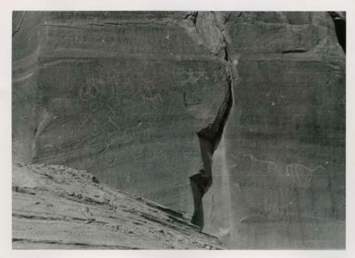 Petroglyph with humans, horses and abstract designs