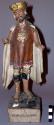 Polychromed wood & gesso figure of standing male, wearing tunic with decorative