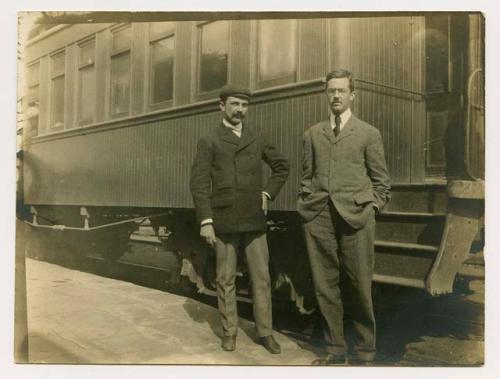 Tozzer, Alfred M. (1877 - 1954) Papers - photograph of Tozzer and another man standing in front of train