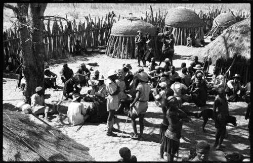 Group of people standing inside a kraal