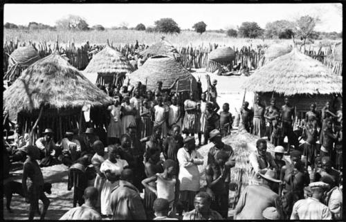 Group of people standing inside a kraal