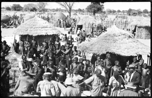 Group of people standing inside a kraal