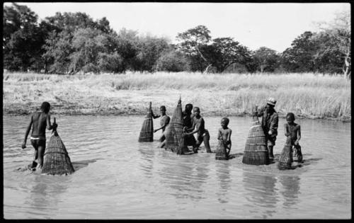 People fishing with baskets