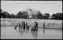 People fishing with baskets