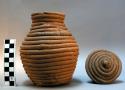 Coiled clay jar with lid
