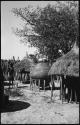 Storage baskets, two thatched roofs on poles