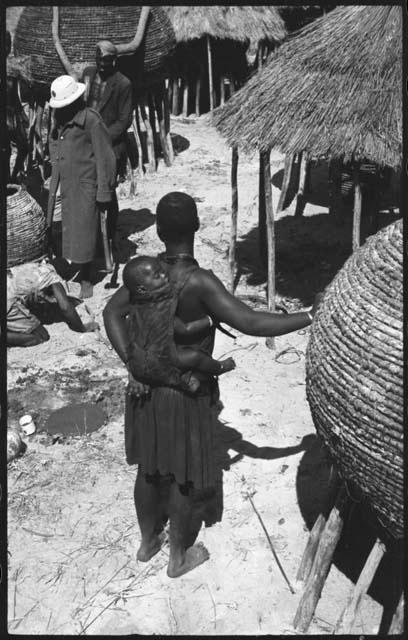 Woman carrying a baby on her back