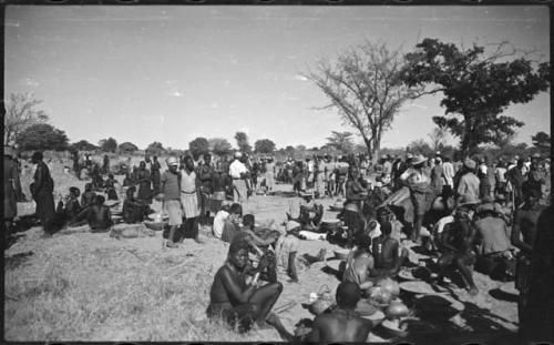 Group of people sitting and standing