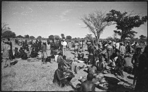 Group of people sitting and standing