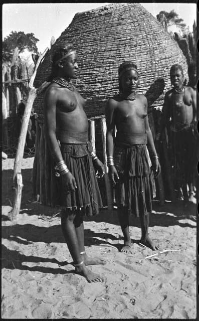 Women standing in front of a storage basket