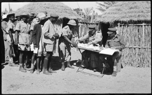 Government officials collecting grain tax from Ovambo people